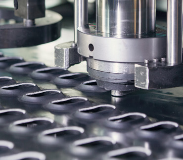 Punching of sheet material